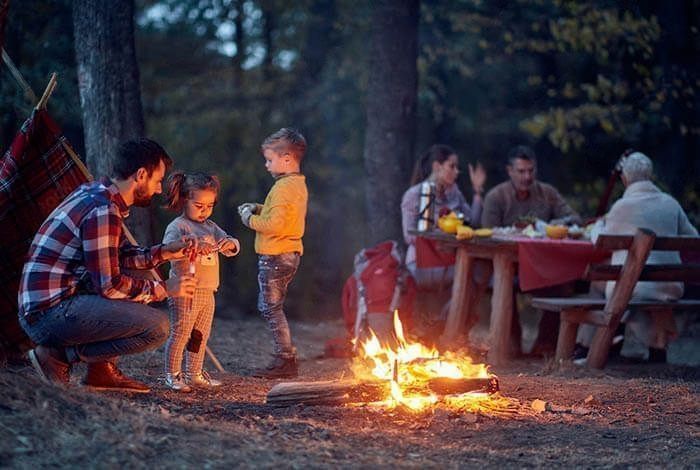 This may seem like a no-brainer, but you’d be surprised how many people try to start a fire anywhere and everywhere. If there’s no designated fire pit, find a clear area at least 10 feet away from trees, bushes, or other flammable objects.